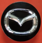 [DODUR04TAPRHCE] TAPON CENTRO RIN MAZDA VARIOS MODELOS NEGRO CON CROMO 57 MM ORIGINAL USADO 1 PZA